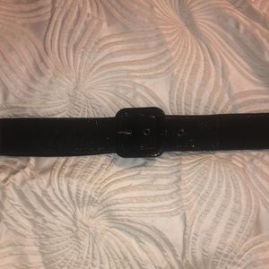 EUC Patent Leather elastic black belt. 4 hole closure.